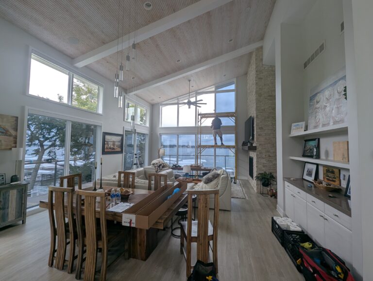 Great room with tall windows in an Okoboji lake home