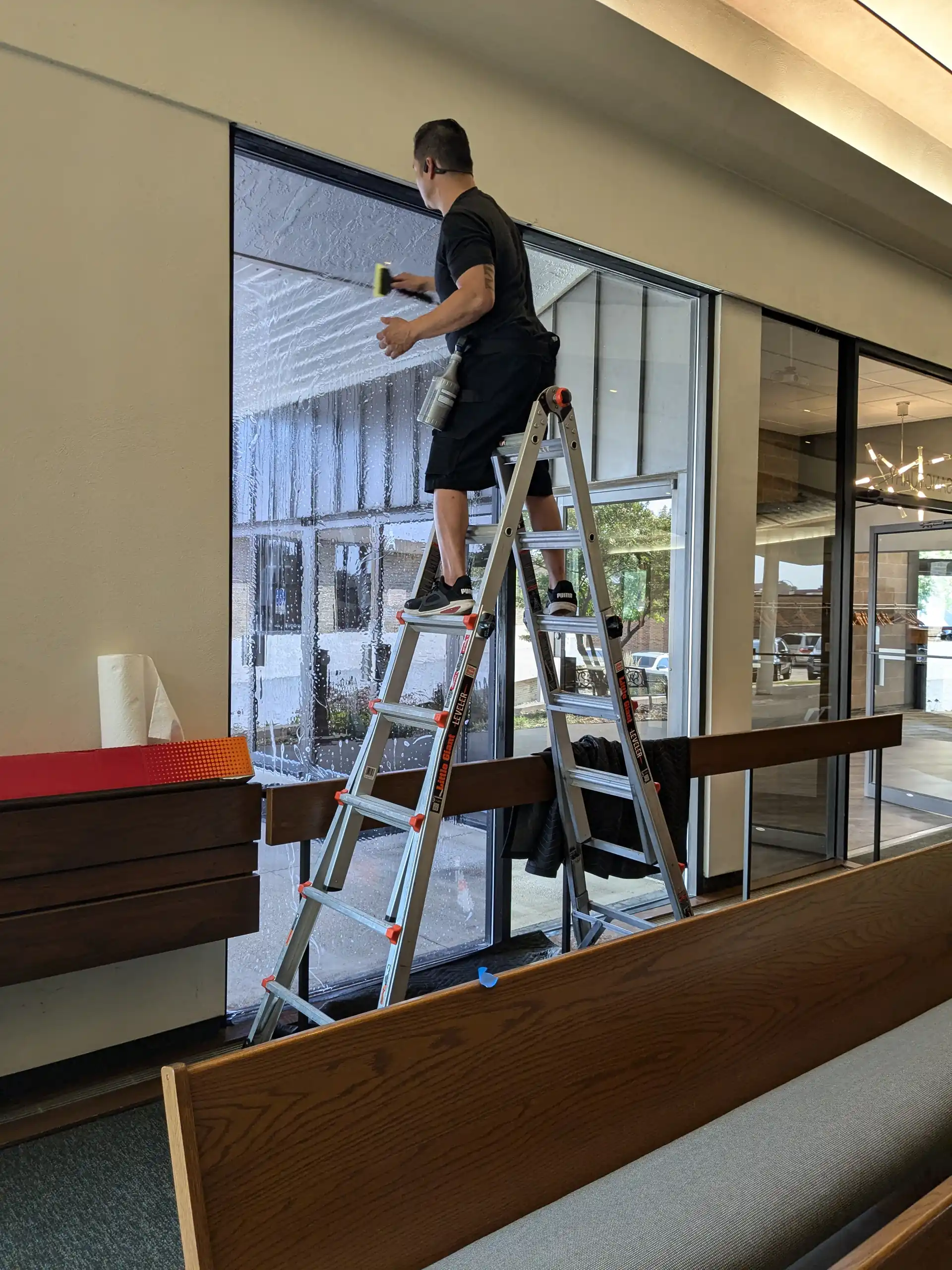 Church sanctuary windows during window film installation (interior)
