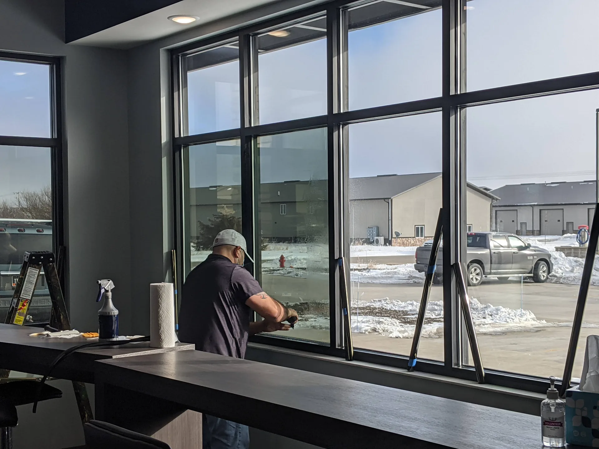 Dental office windows with DR15 glare control film during installation