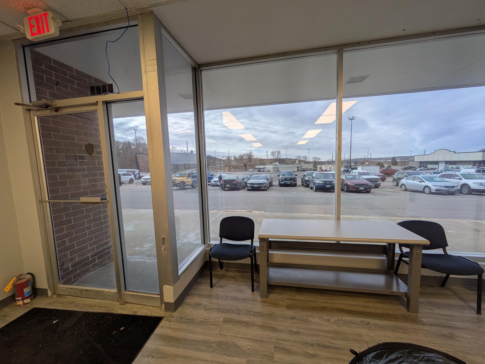 Office interior with glass doors and large windows