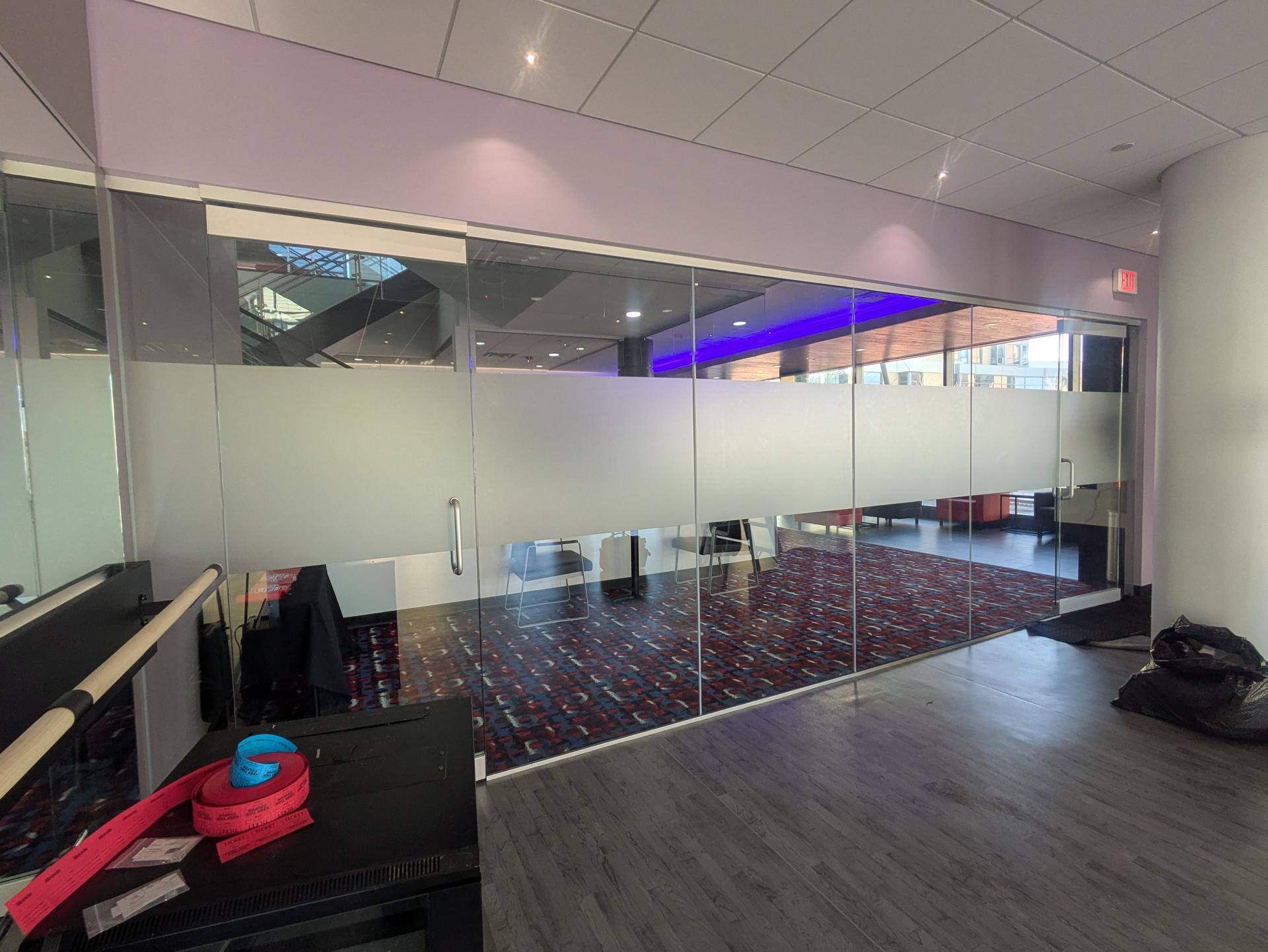 Office glass wall with a frosted band of window film