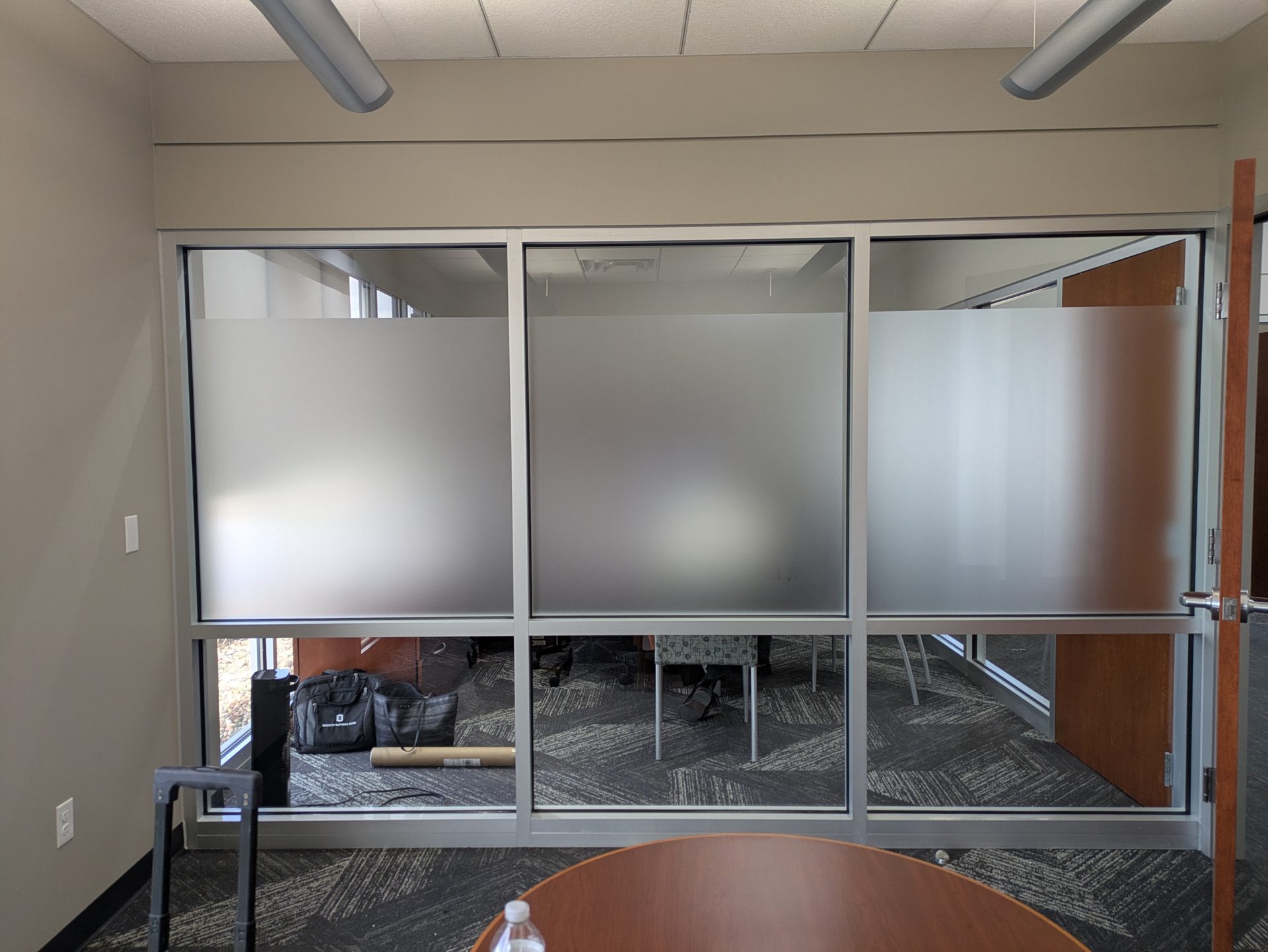 Office glass wall with frosted window film