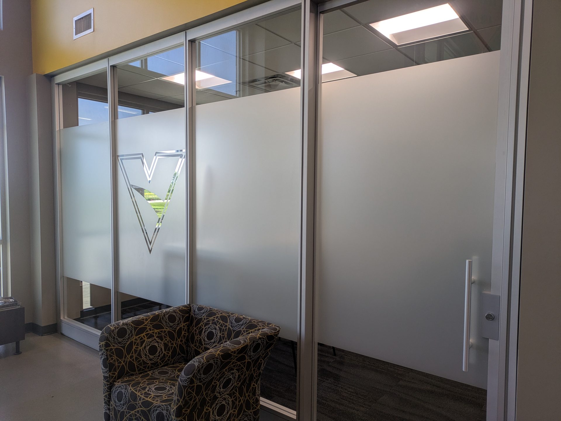 Office glass partition with frosted window film