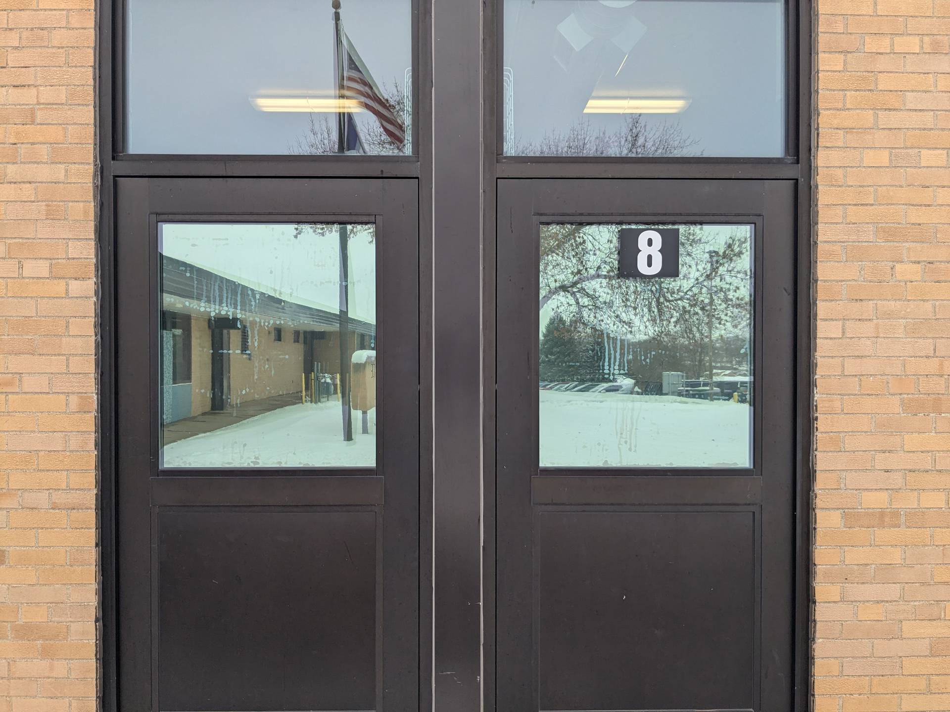 School entrance glass during security window film installation