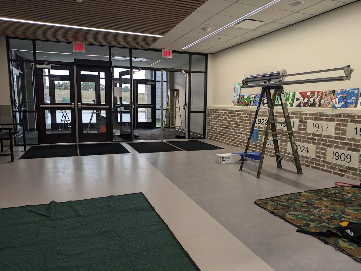 School entrance vestibule glass during security window film install (interior)